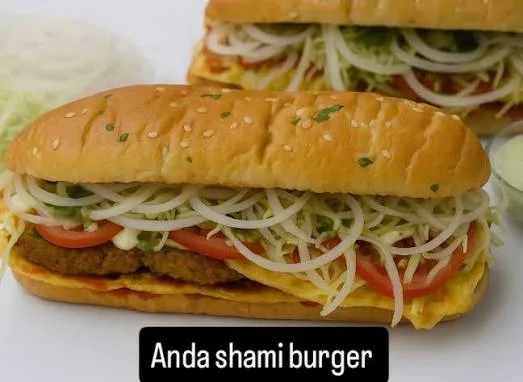 Anda shami burger with a golden shami patty, fried egg, fresh salad and chilli mayo in a toasted bun on a wooden board